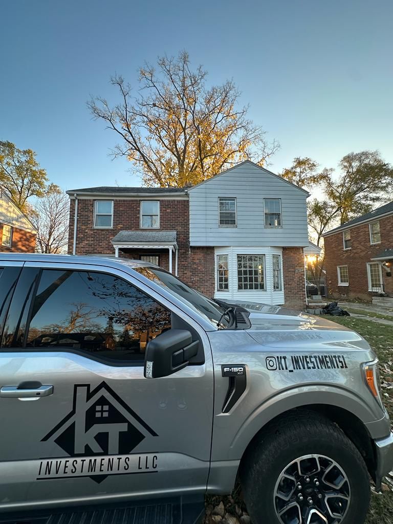 K&T Investments truck in front of a Detroit home